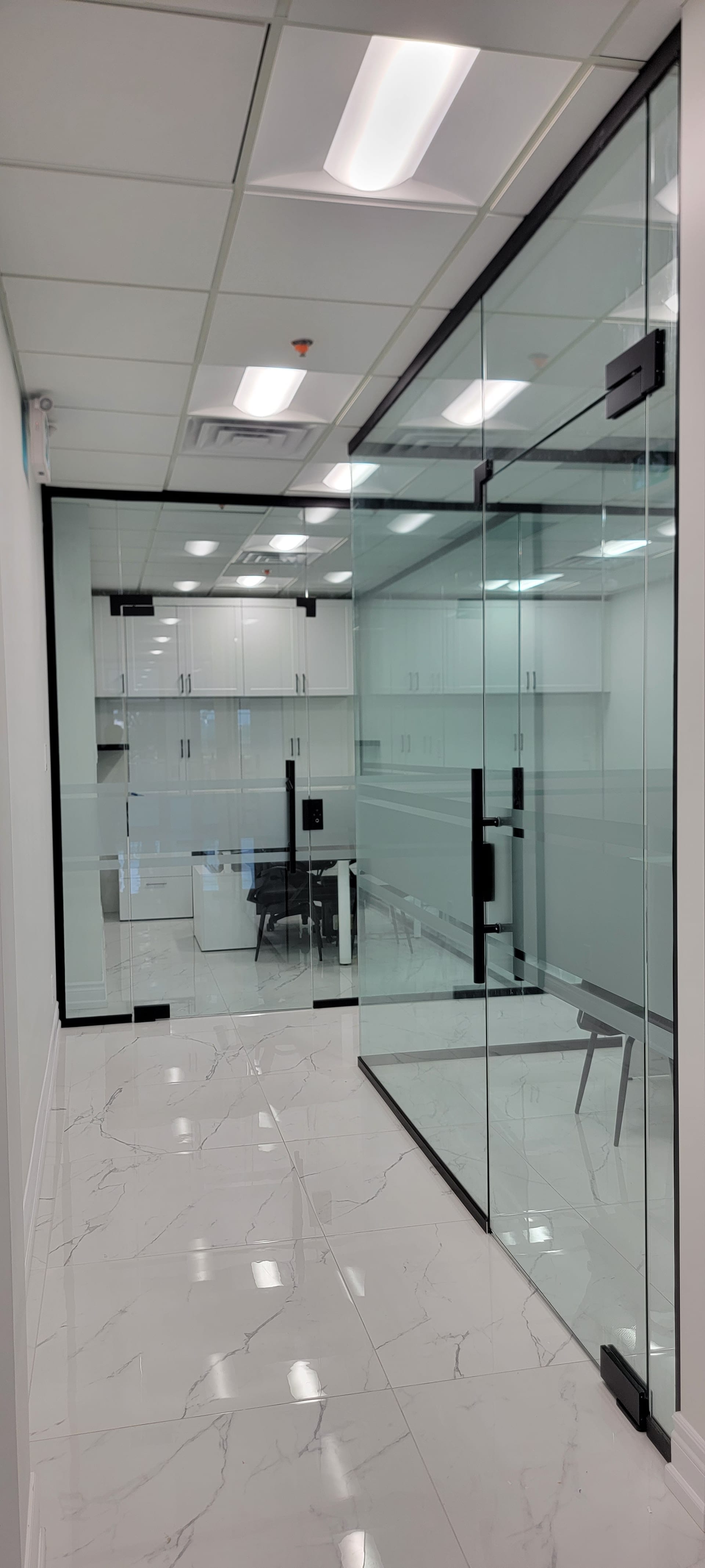 Commercial glass partition in executive office — commercial glazing installation by Built By Glass, Greater Toronto Area